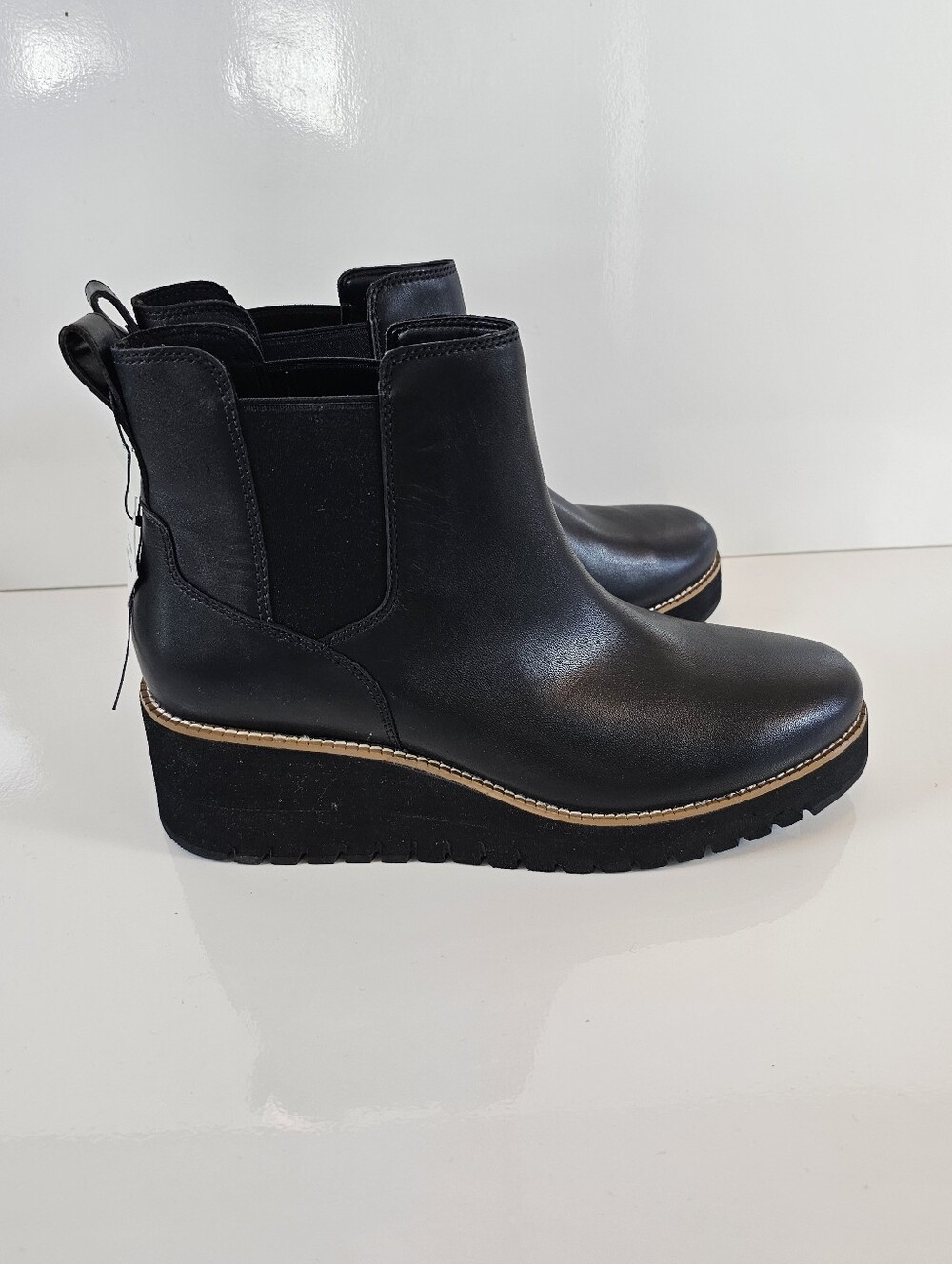 Cole Haan ZERØGRAND City Wedge Waterproof Chelsea Boots in black leather.